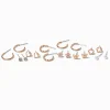 Claire's Anneaux|Clous D'oreilles-Boucles d'oreilles fleurs papillon couleur dorée - Lot de 9