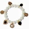 Claire's Bracelets-Bracelet élastique breloque perle d'imitation couleur dorée
