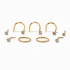 Claire's Clous D'oreilles|Bijoux Premium-Clous et anneaux pour piercing de nez 0,6 mm avec zircon cubique en titane couleur dorée - Lot de 9