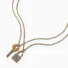 Claire's Colliers-Colliers à pendentifs couleur dorée clé et cadenas pavé - Lot de 2